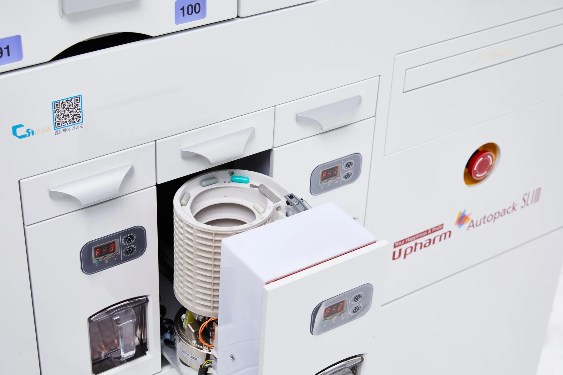 FSP drawer open on a CRETEM packager showing the rotary hopper